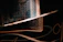 A close-up of the Inner Whispers Tarot card with elegant foil edging catching soft light.