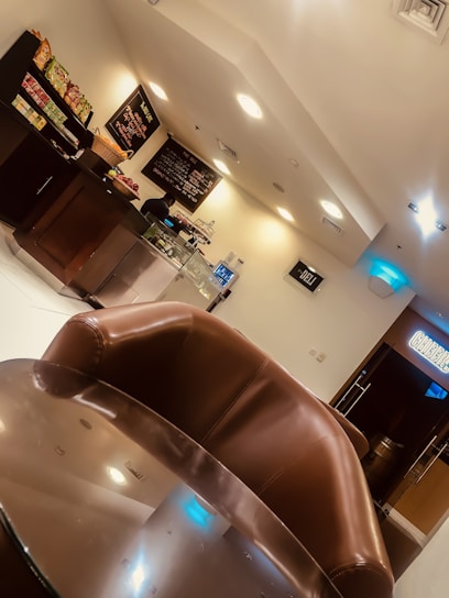 Cozy restaurant interior with warm lighting and a welcoming counter filled with fresh snacks and juices.