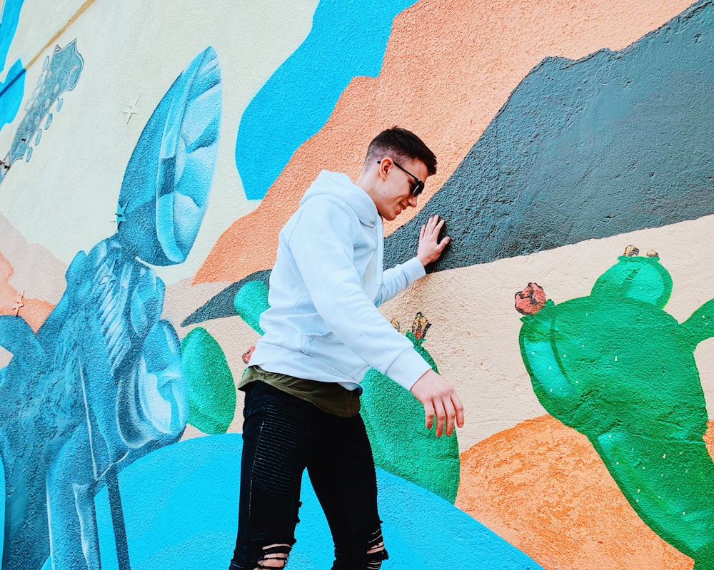 man wearing white pullover hoodie