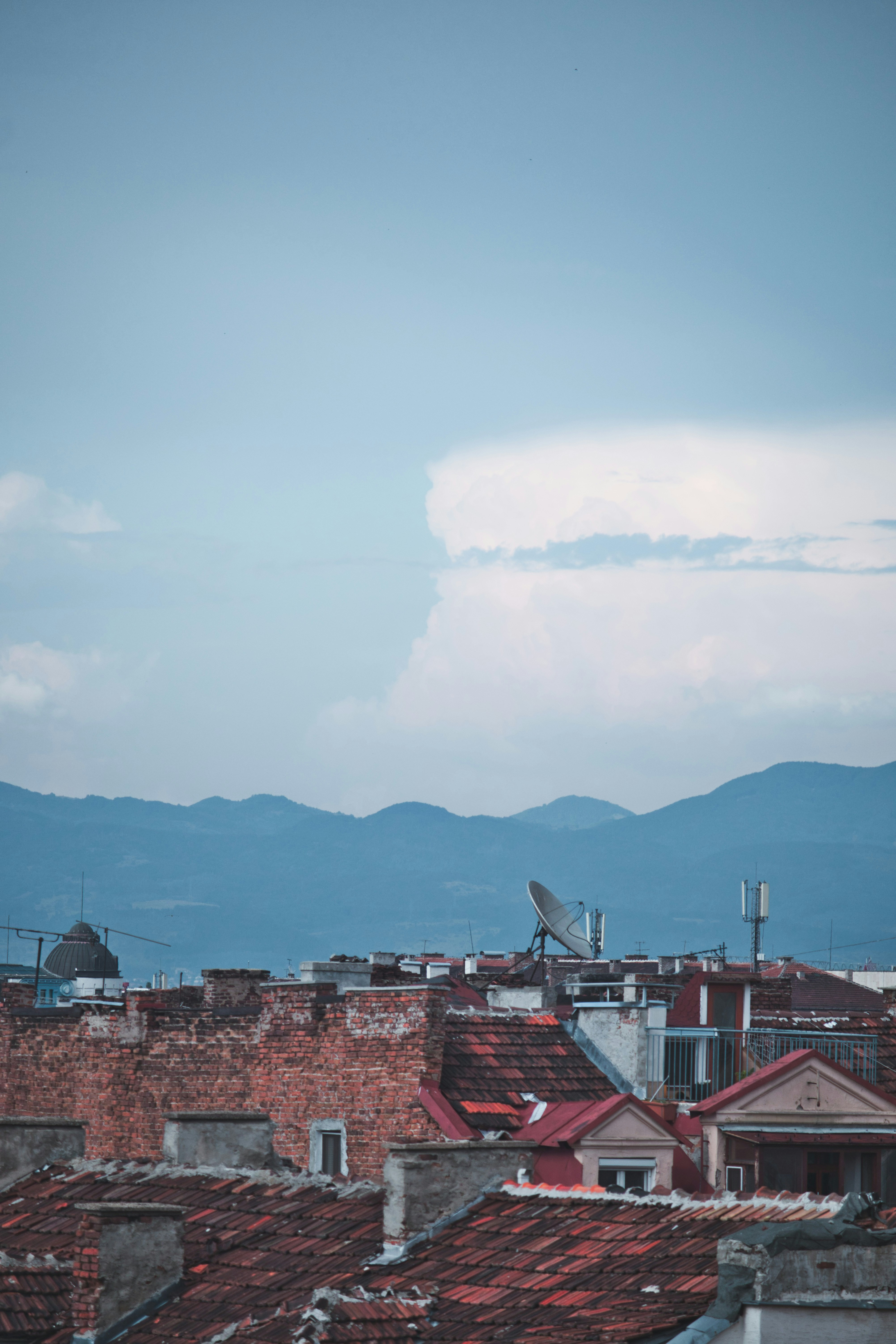 High-angle view of Sofia city showing commercial buildings and mountains