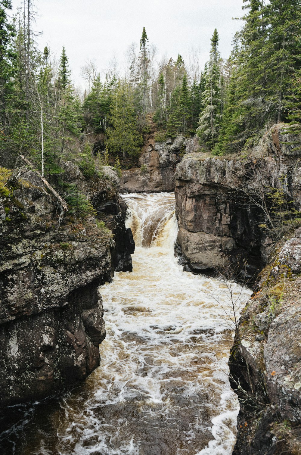 river waterfalls beside rocks