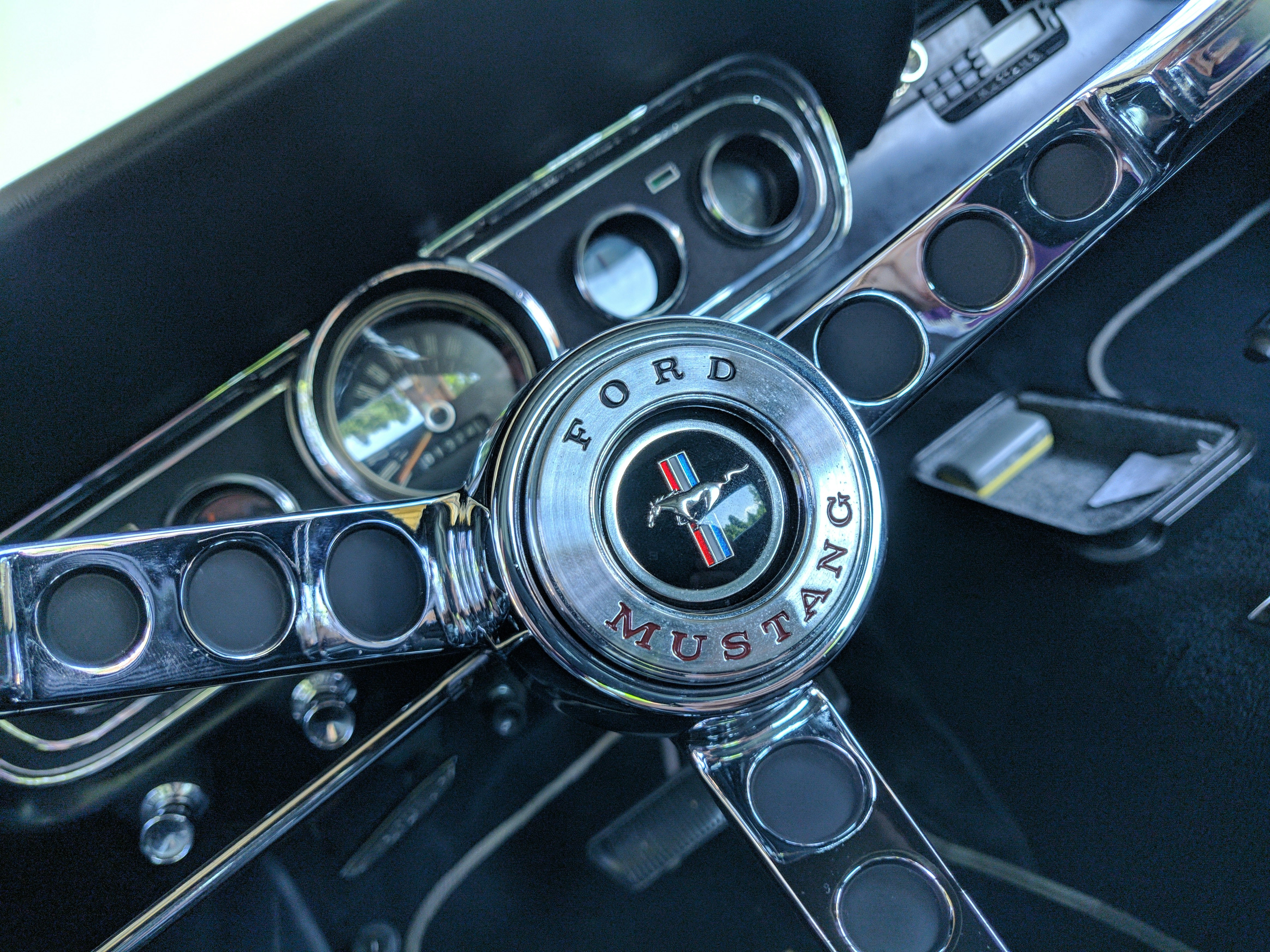 a close up of a steering wheel on a car
