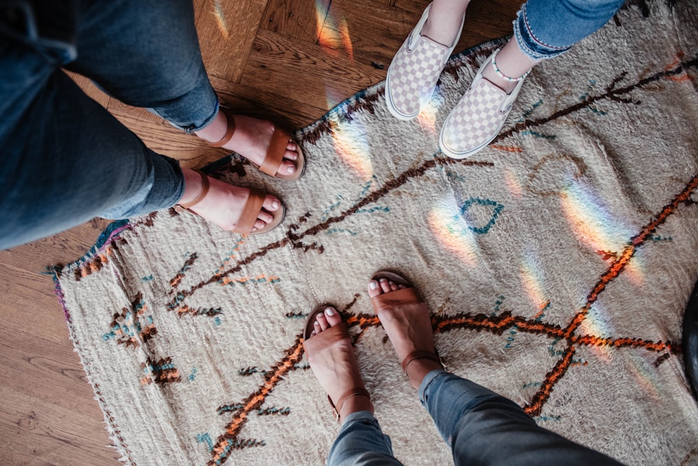 people standing on area rug