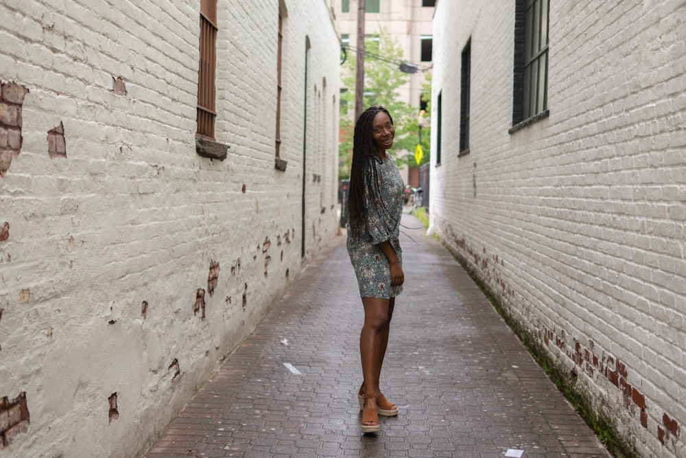 women standing in an alley during daytime