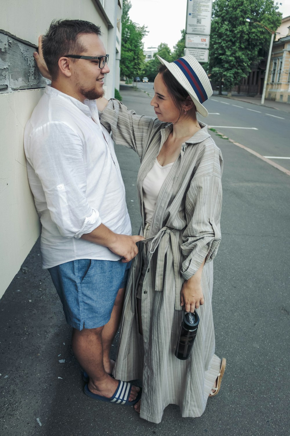 man standing in front of woman