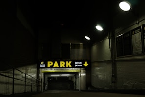 Spacious parking lot with clear signage and 24-hour access gates.