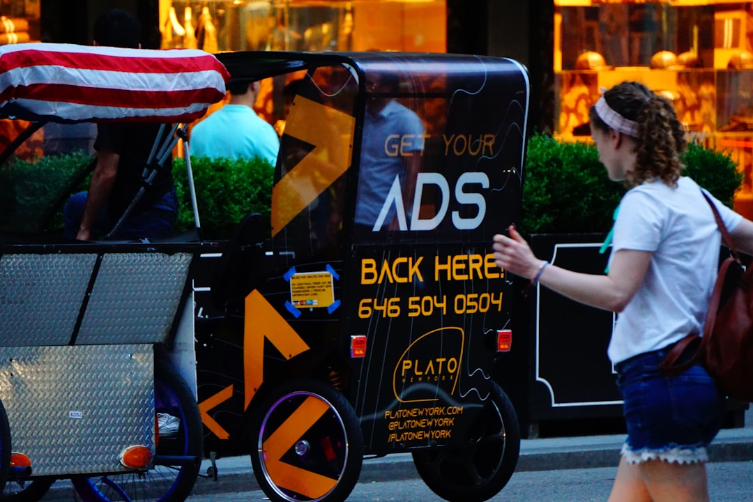 woman passing on road during daytime