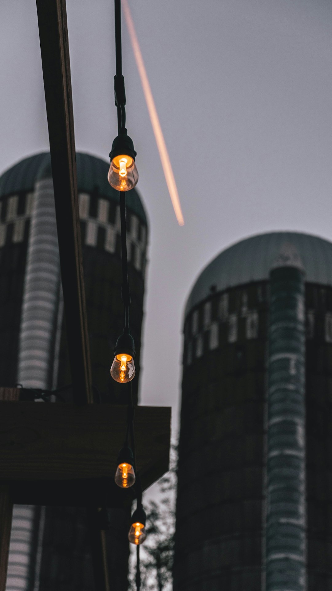 lighted pendant bulbs hanging outside building