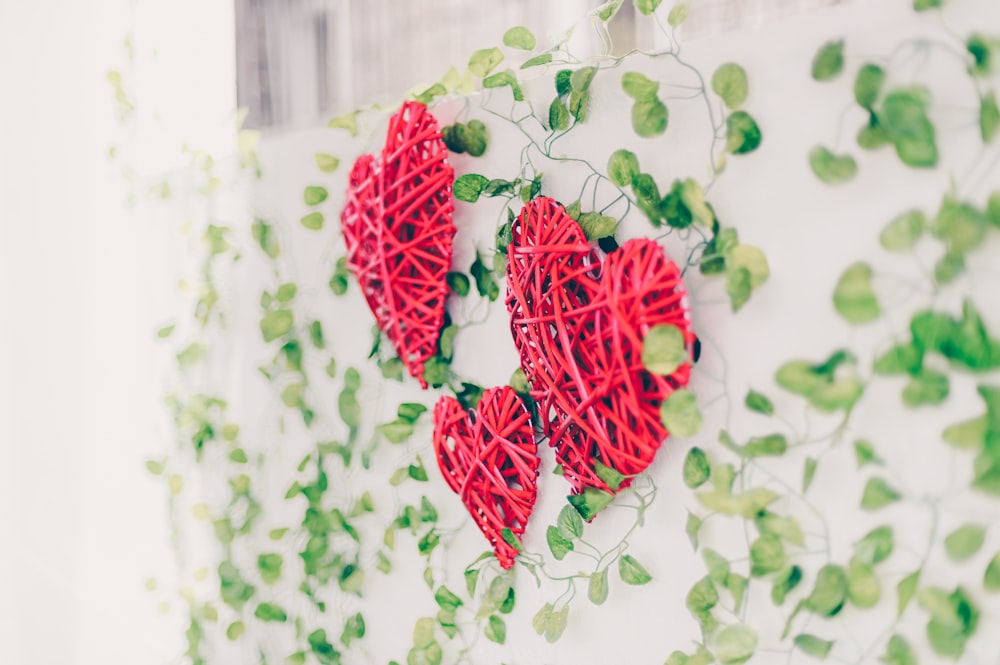 three red heart wall decors