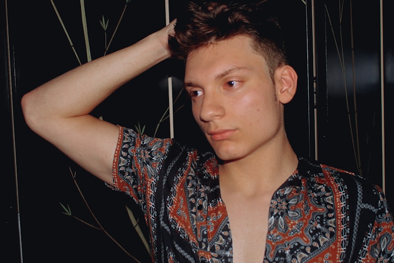 gay man in colorful floral top