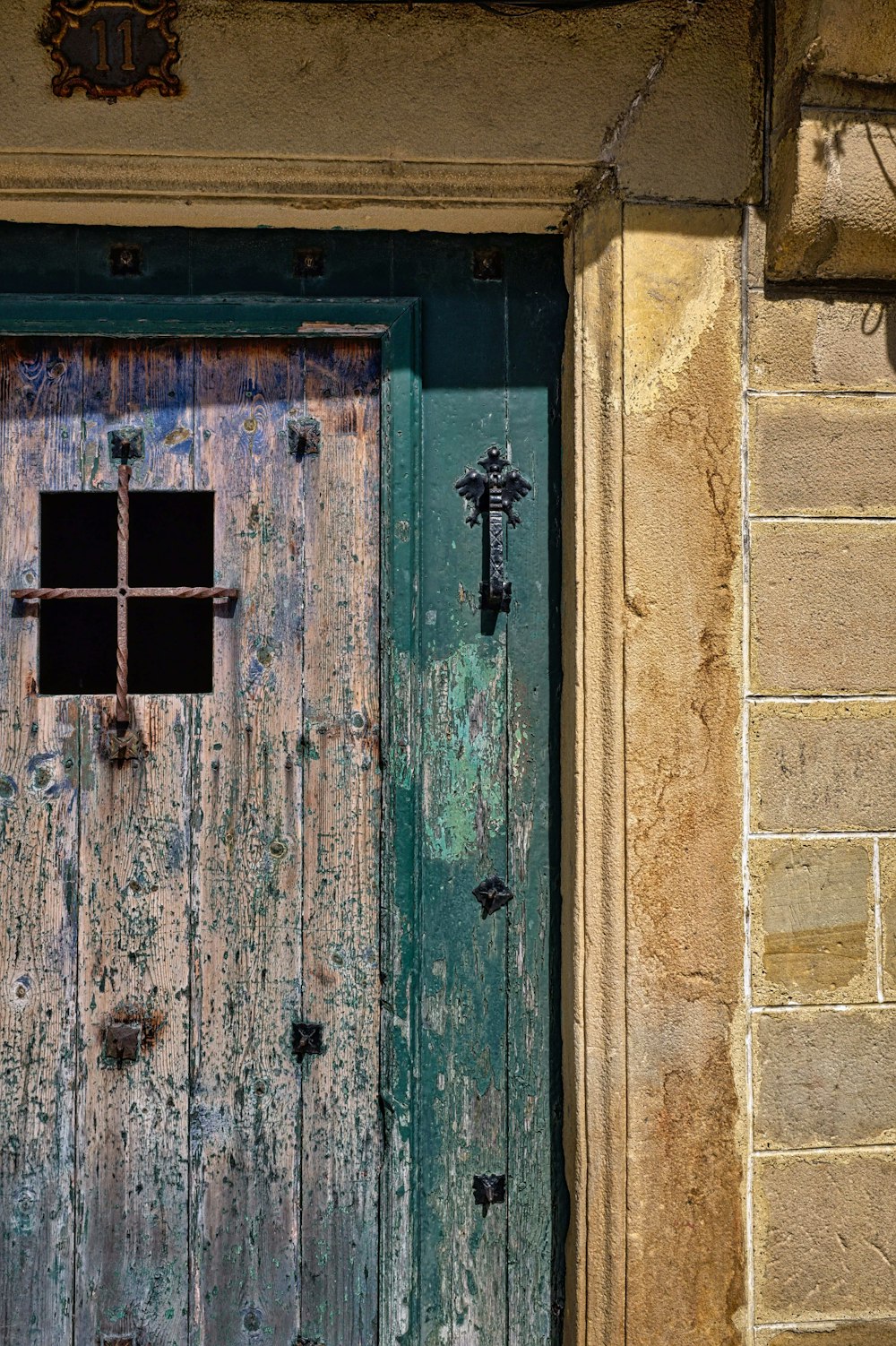 closed green and brown wooden door panel