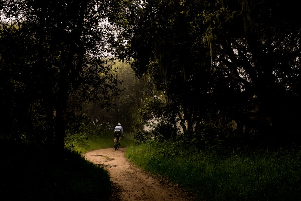 man riding bicycle photography