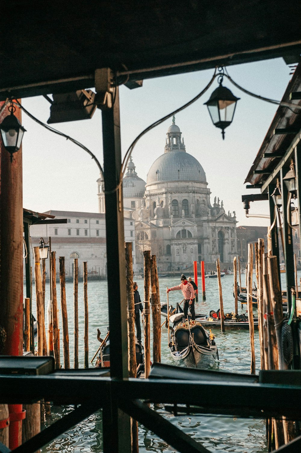 man on boat near mosque at daytime