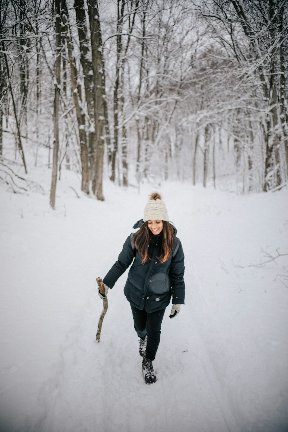 woman in forest covered in snow