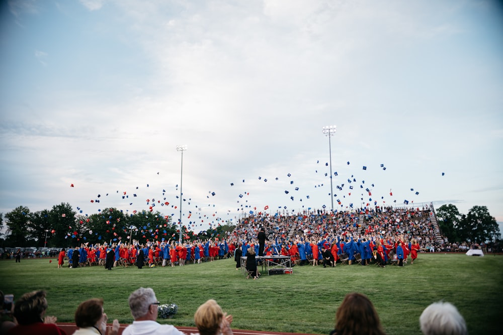 group of students throwing their mortar boards