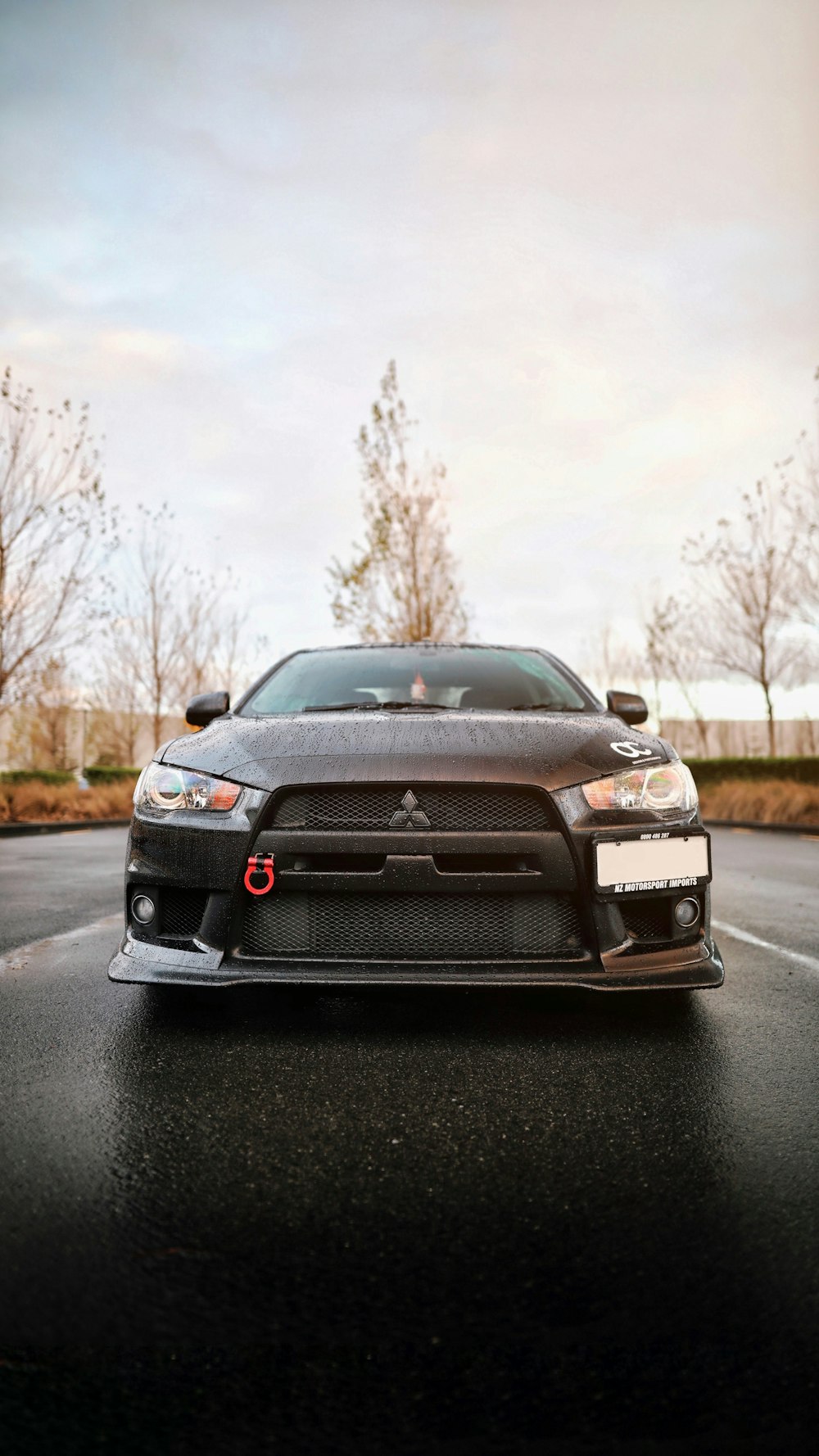 selective focus photography of black Mitsubishi car