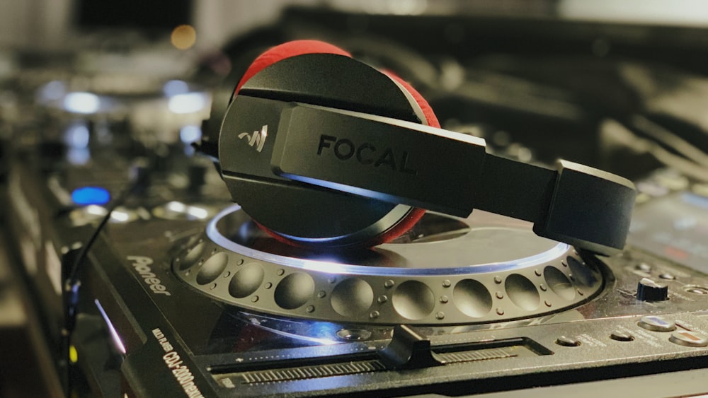 black headphones on DJ mixer
