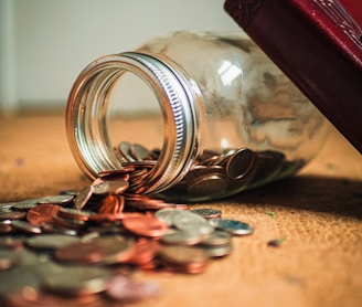 assorted coin lot in clear glass jar