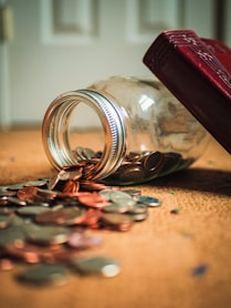 assorted coin lot in clear glass jar