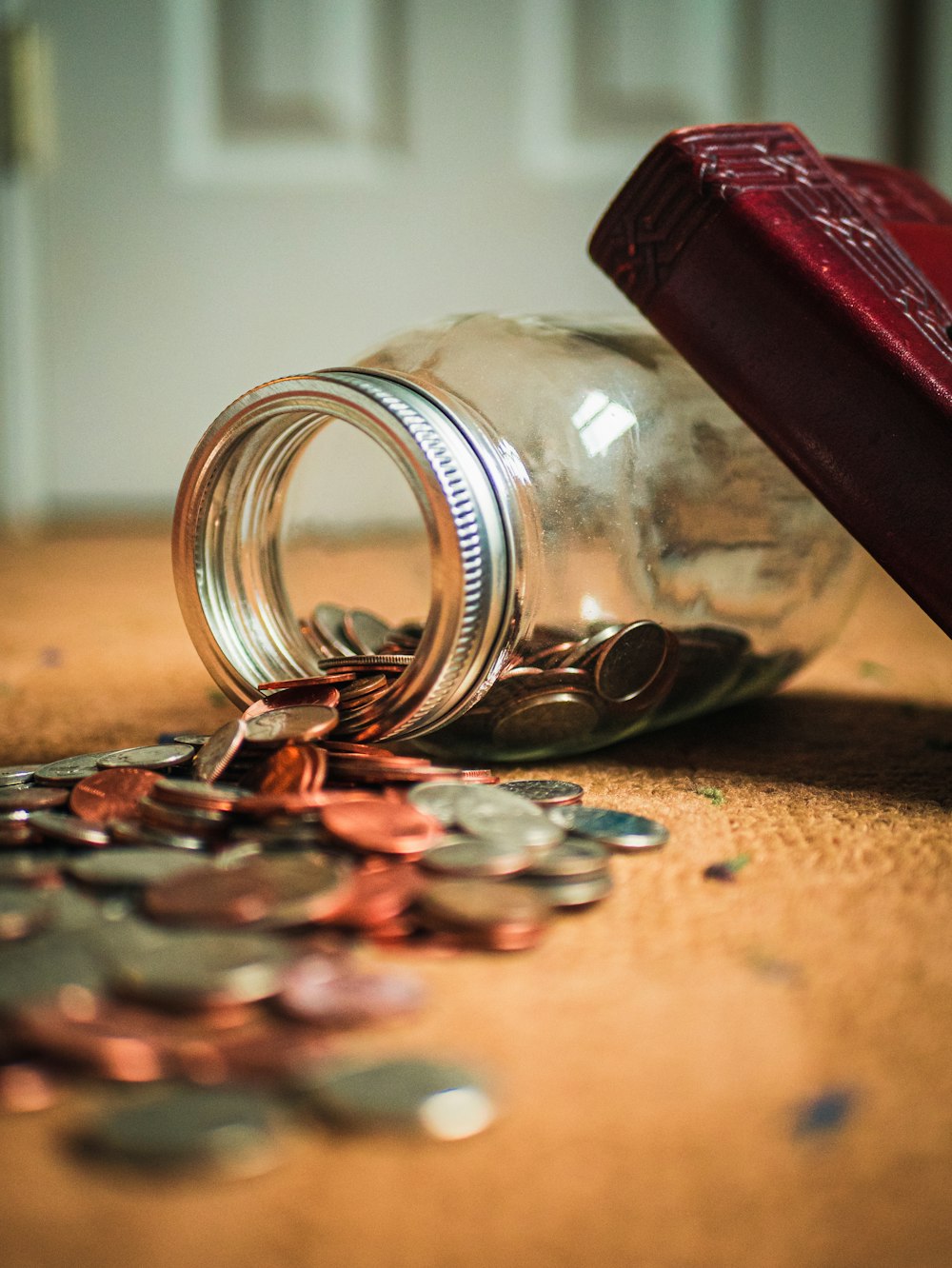 assorted coin lot in clear glass jar