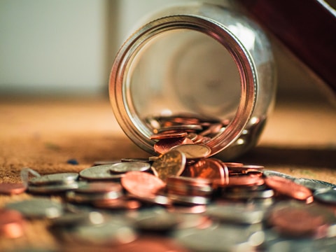 close-up photo of assorted coins; save money