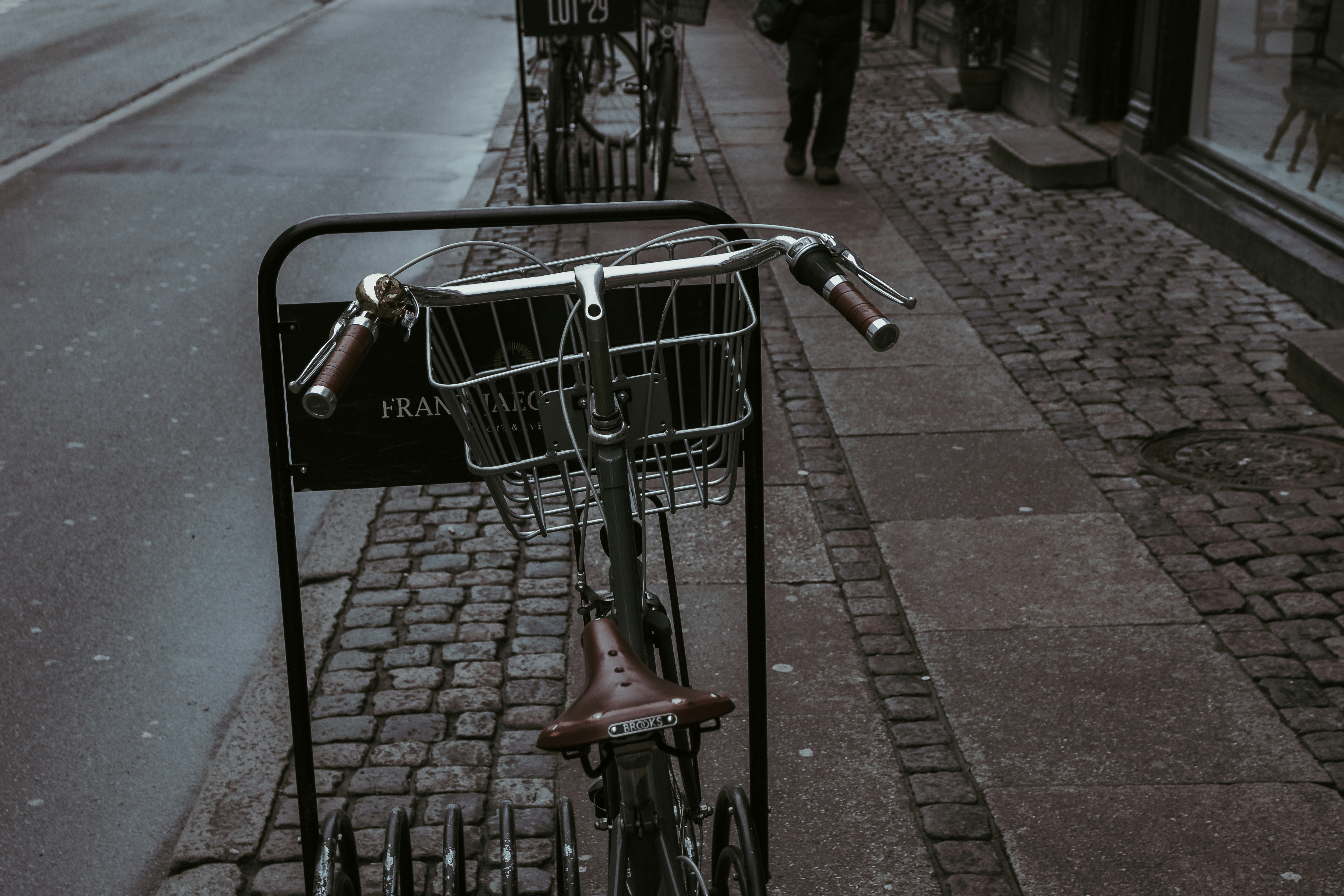 gray stainless steel and brown bike near pathway