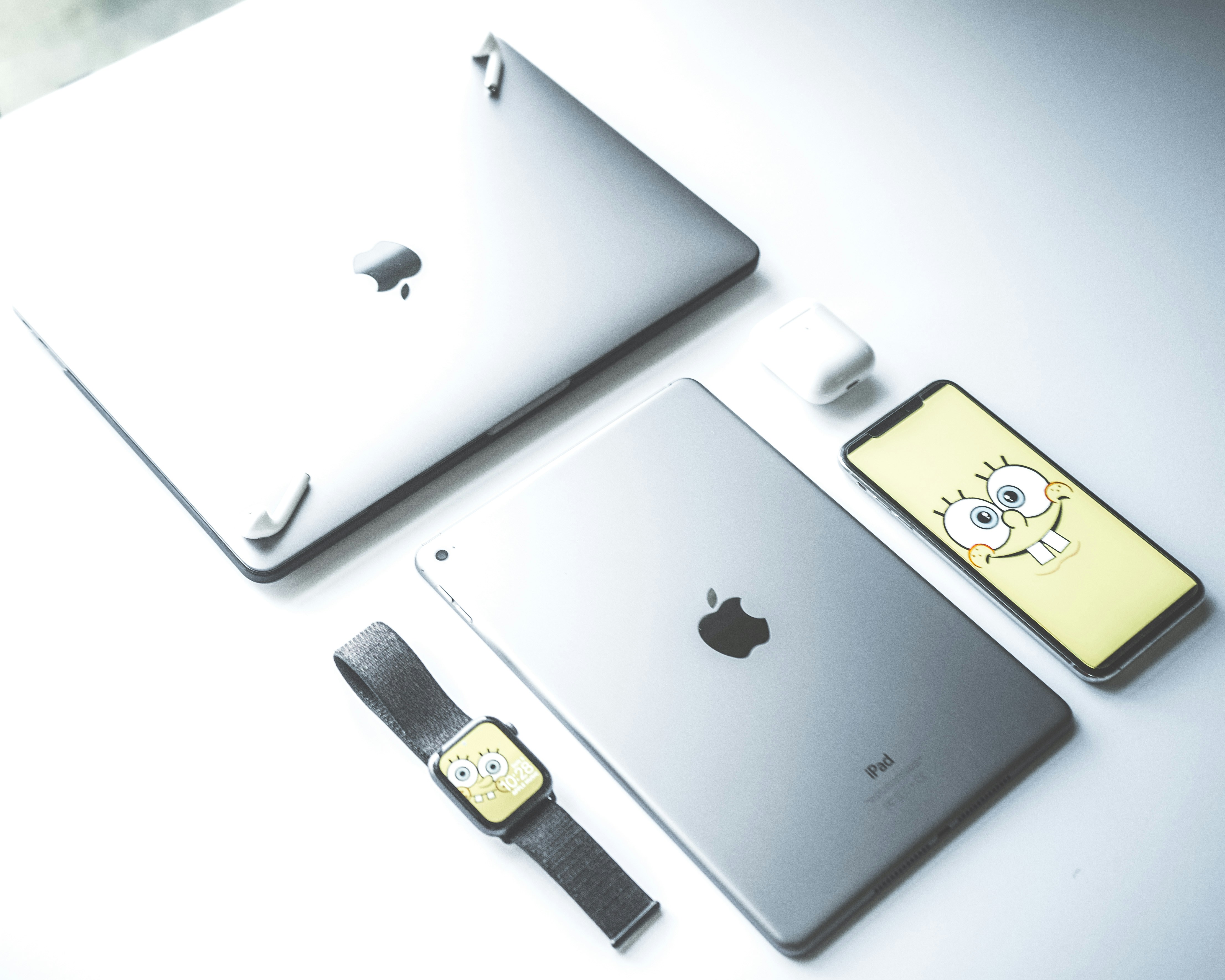 Silver Apple Macbook Air Ipad And Iphone On Desk Photo Free