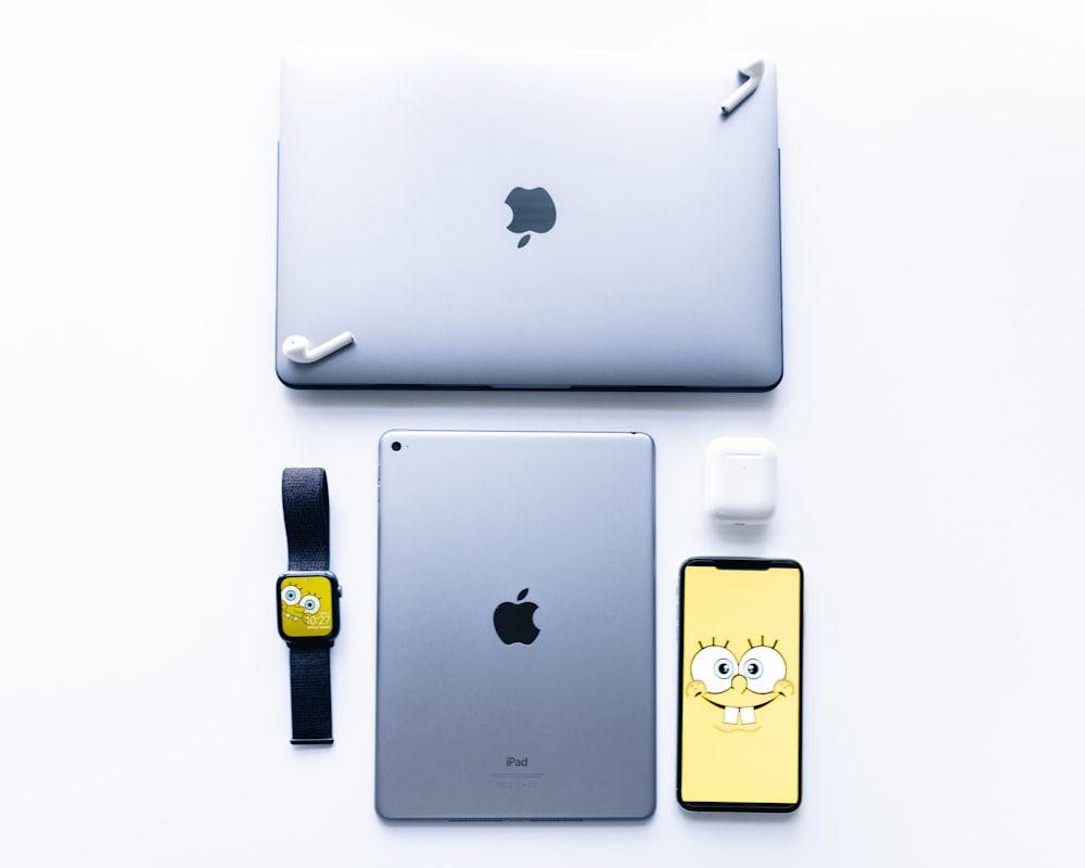 silver Apple Macbook Air, iPad and iPhone