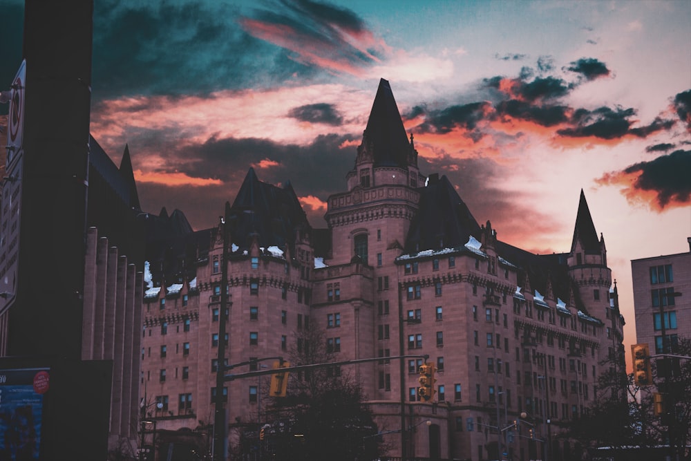 brown and gray castle under orange skies