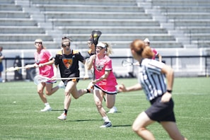 Colorful sports event with players in action on a sunny day.
