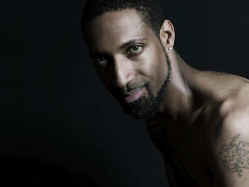 close-up portrait of man with stud earring