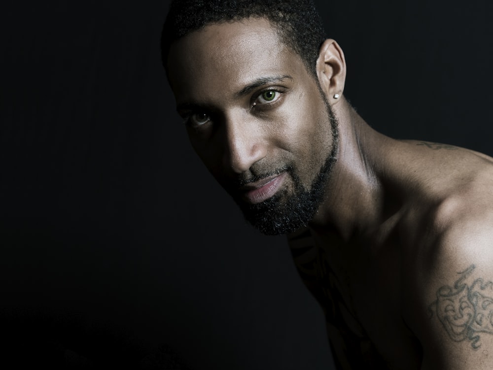 man wearing silver-colored stud earring