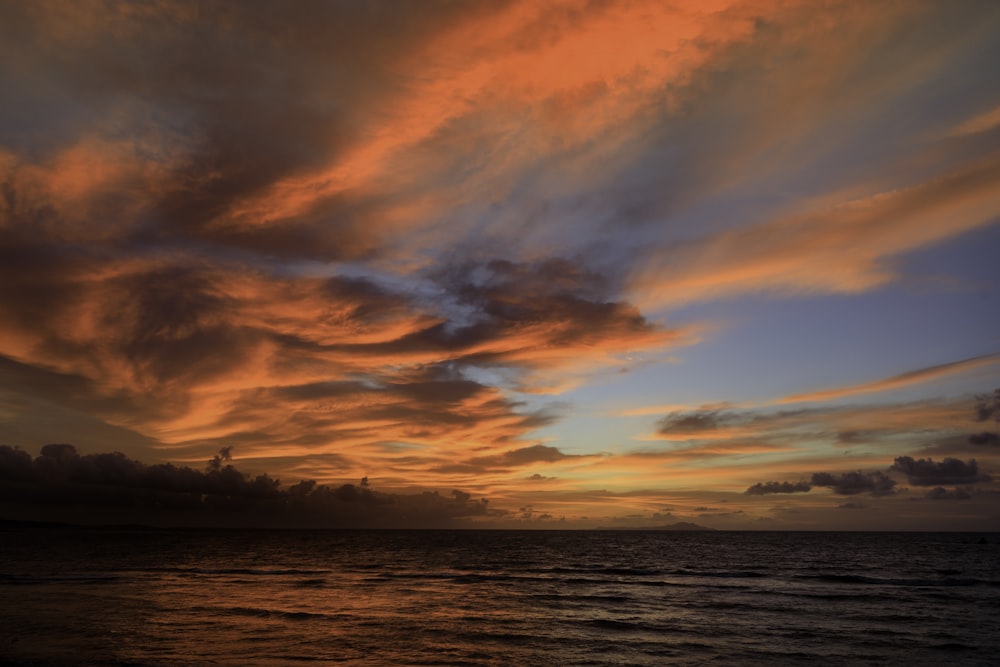 ocean under cloudy sky