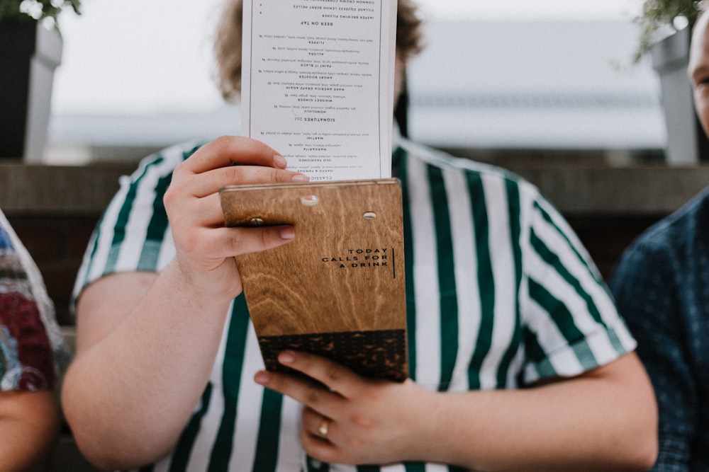 man holding book