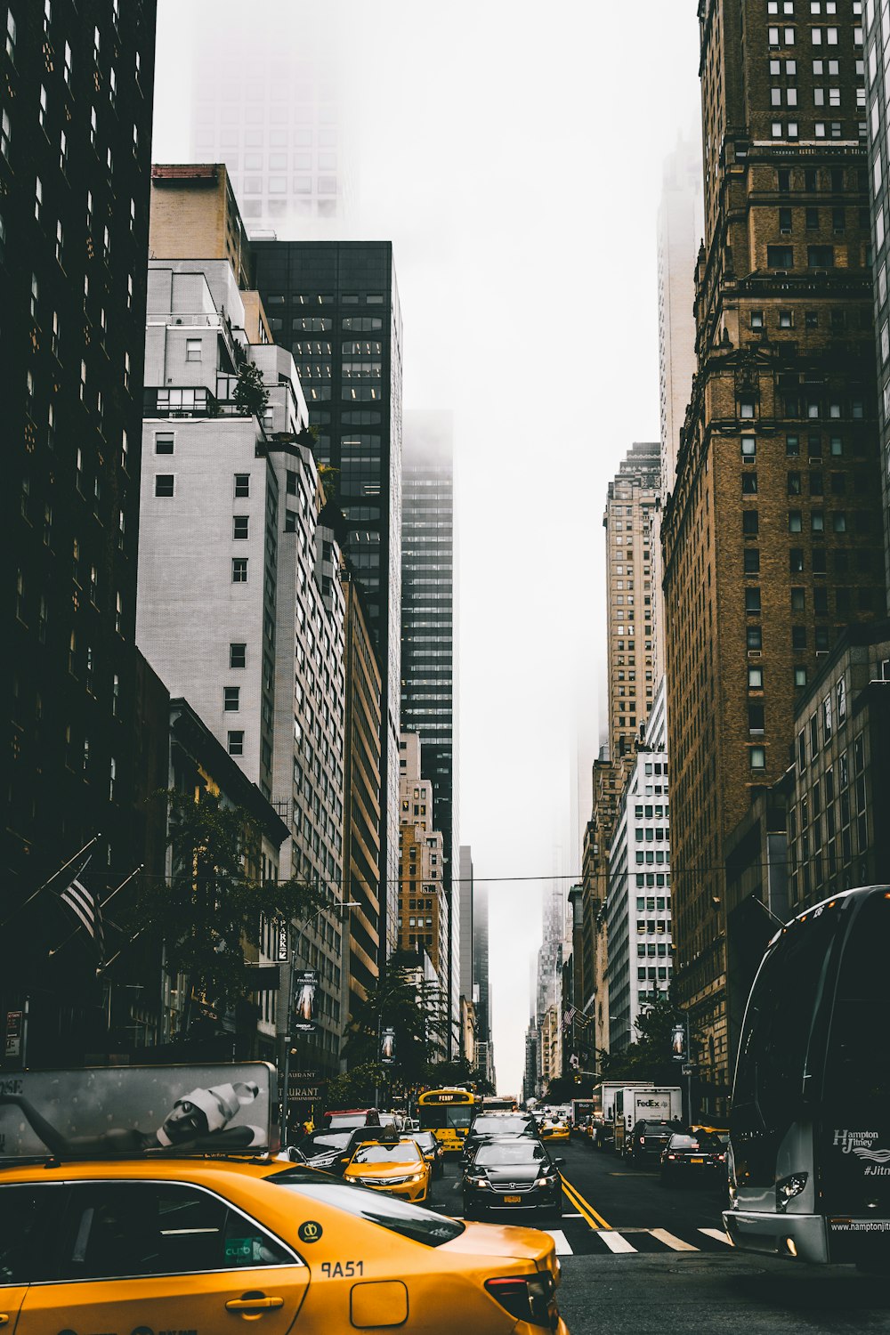 vehicles on road near building