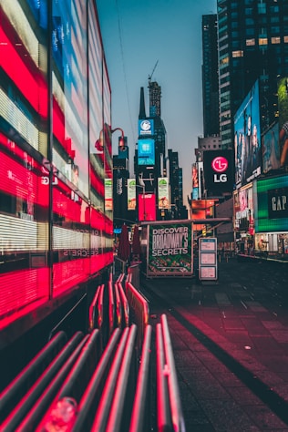 city buildings at night with different colors
