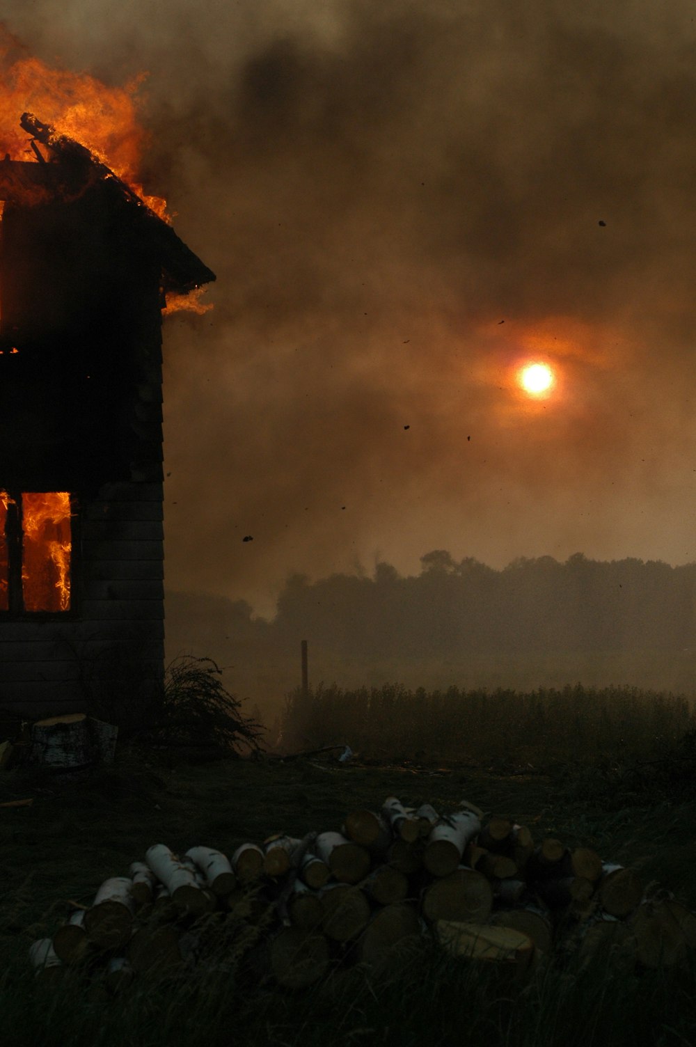 time lapse photography of a burning building during golden hour