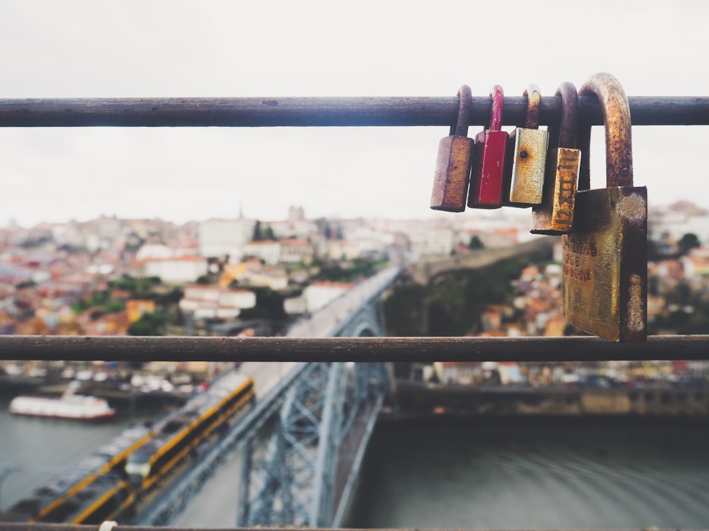 five assorted-color padlocks