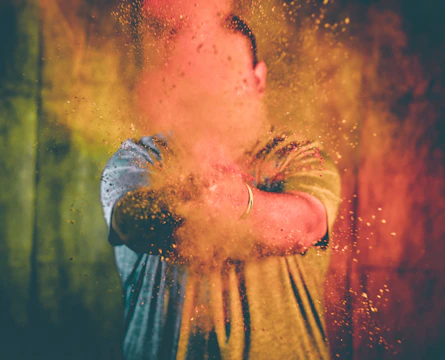 Close-up of colorful powder exploding in the air at the event.