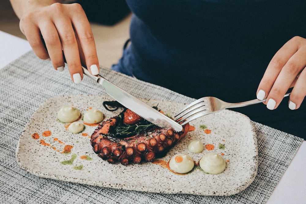 woman eating tentacles food