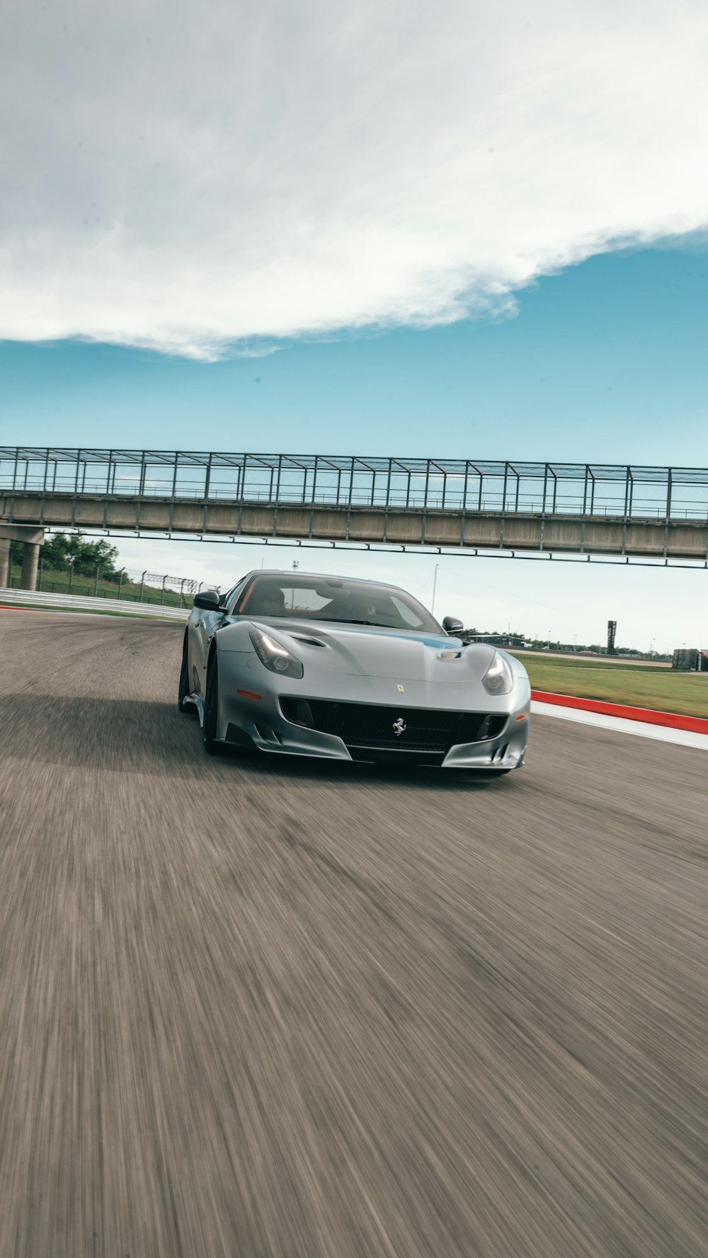 silver car speeding on the road