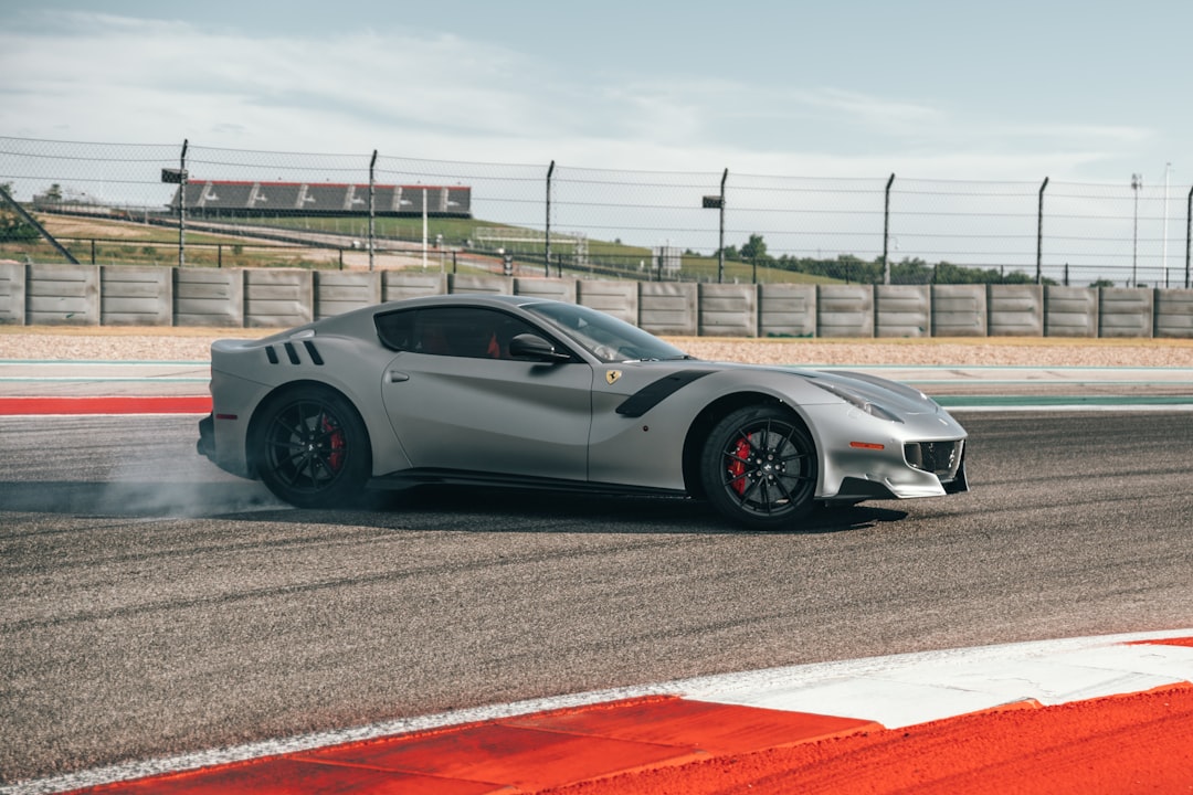 Silver Ferrari on racetrack - Photo by Spencer Davis | best digital marketing - London, Bristol and Bath marketing agency