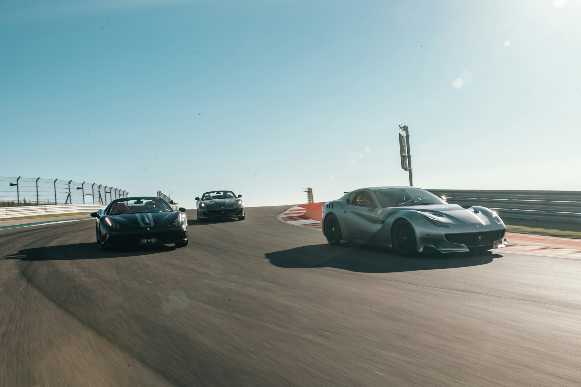 vehicles running on road during daytime