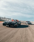 two sports car running during daytime