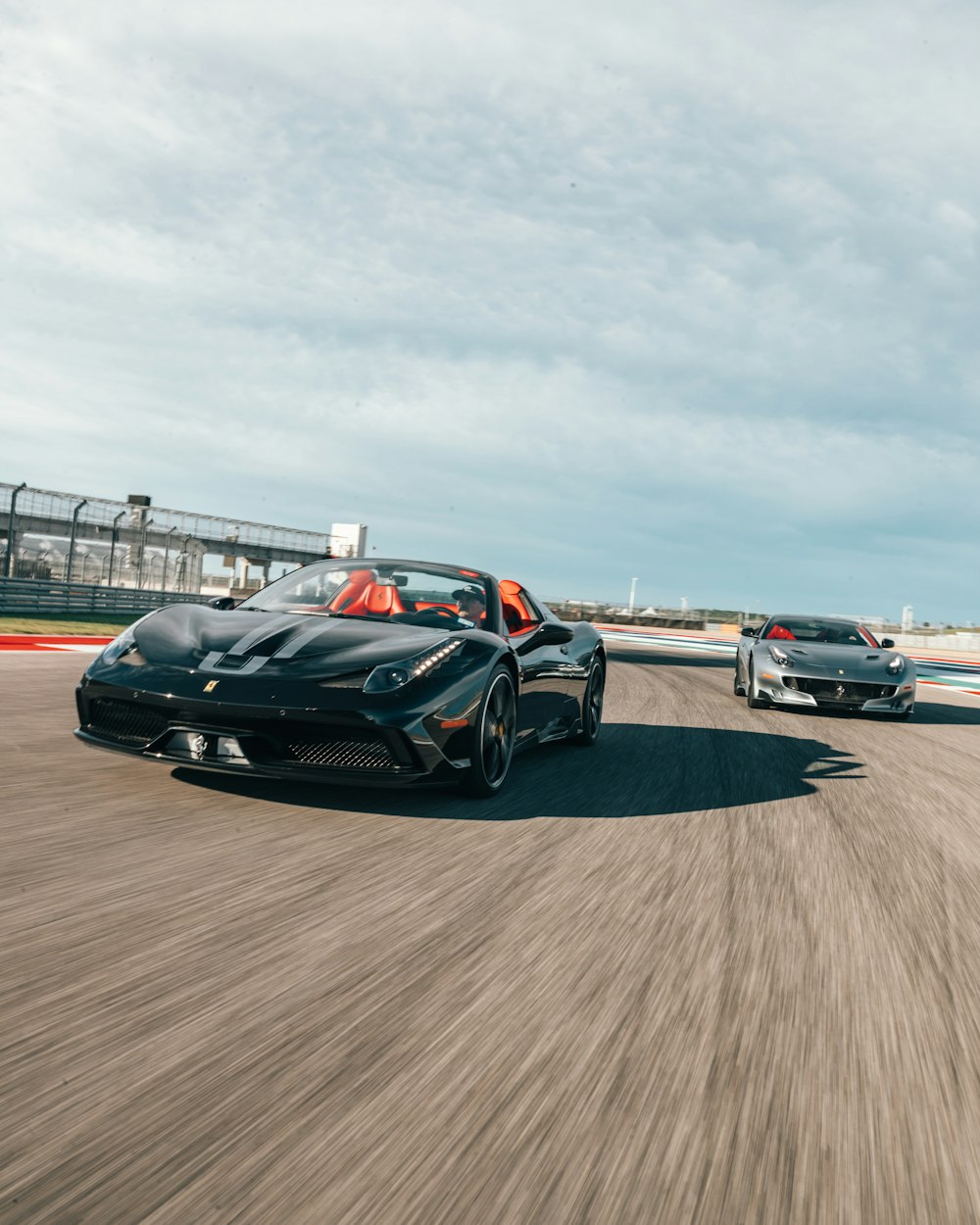 two sports car running during daytime