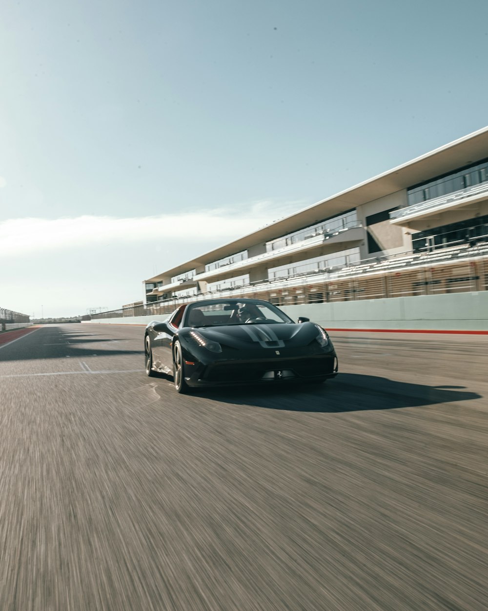 black race car on road