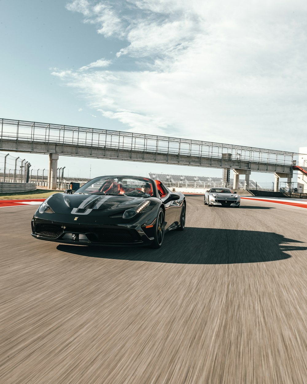 people riding on black coupe during daytime