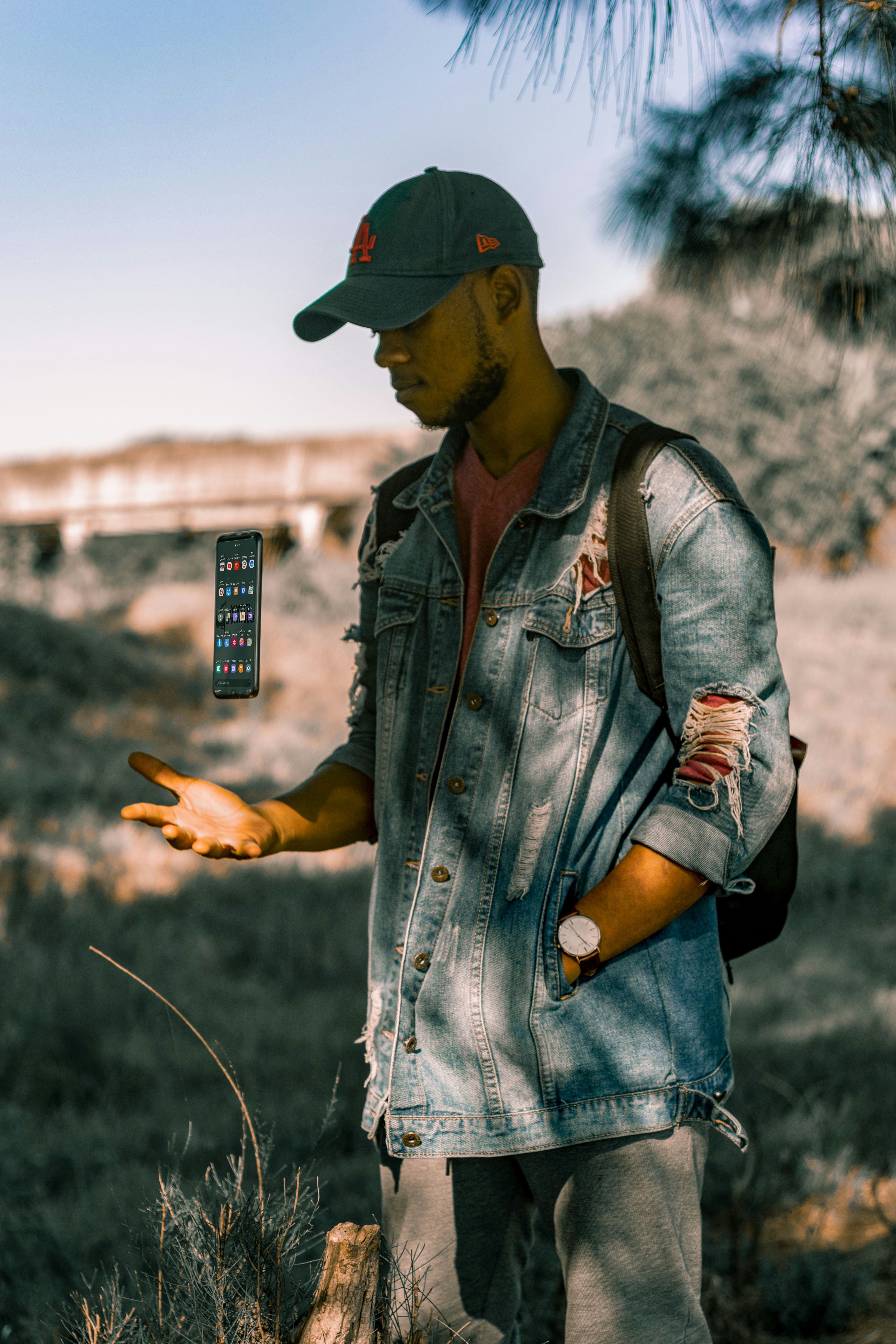 man standing on grass field