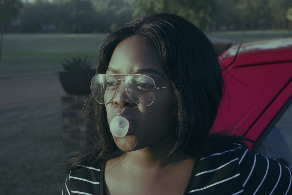 selective focus photography of woman wearing eyeglasses