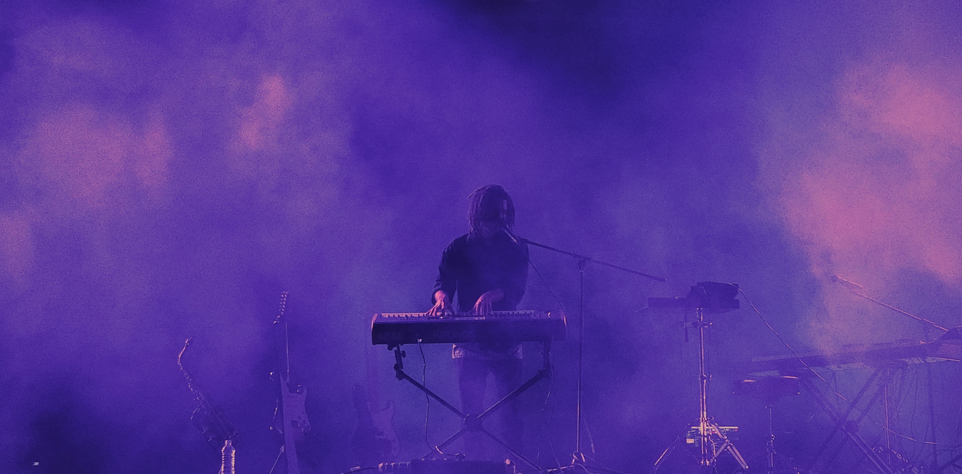 man playing electronic keyboard